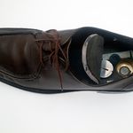Manâs shoe with hollow heel for film cassette: In the 1960s, this shoe with a cavity in the heel and machined metal compartment was of a size capable to conceal a Minox film cassette. 